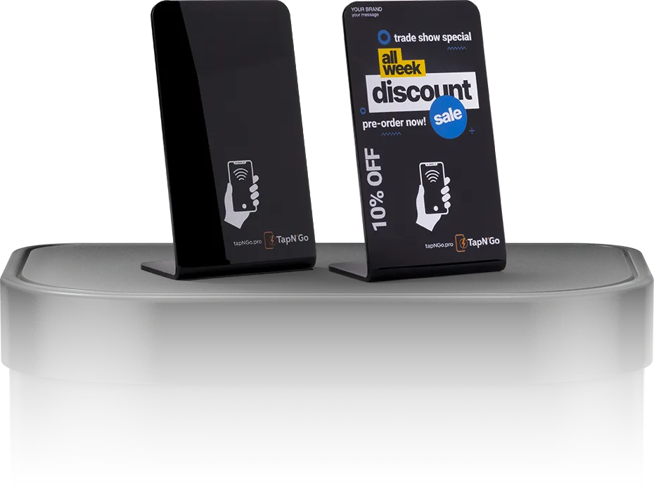 Businessman proudly holding a TapN'Go NFC stand with Data Indicators in the background