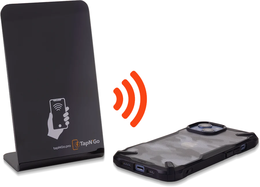 A black NFC stand is pictured with smartphone laying next to it